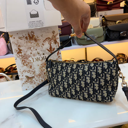 Medium CD Travel Nomad Pouch - Oblique jacquard and a military-inspired CD buckle