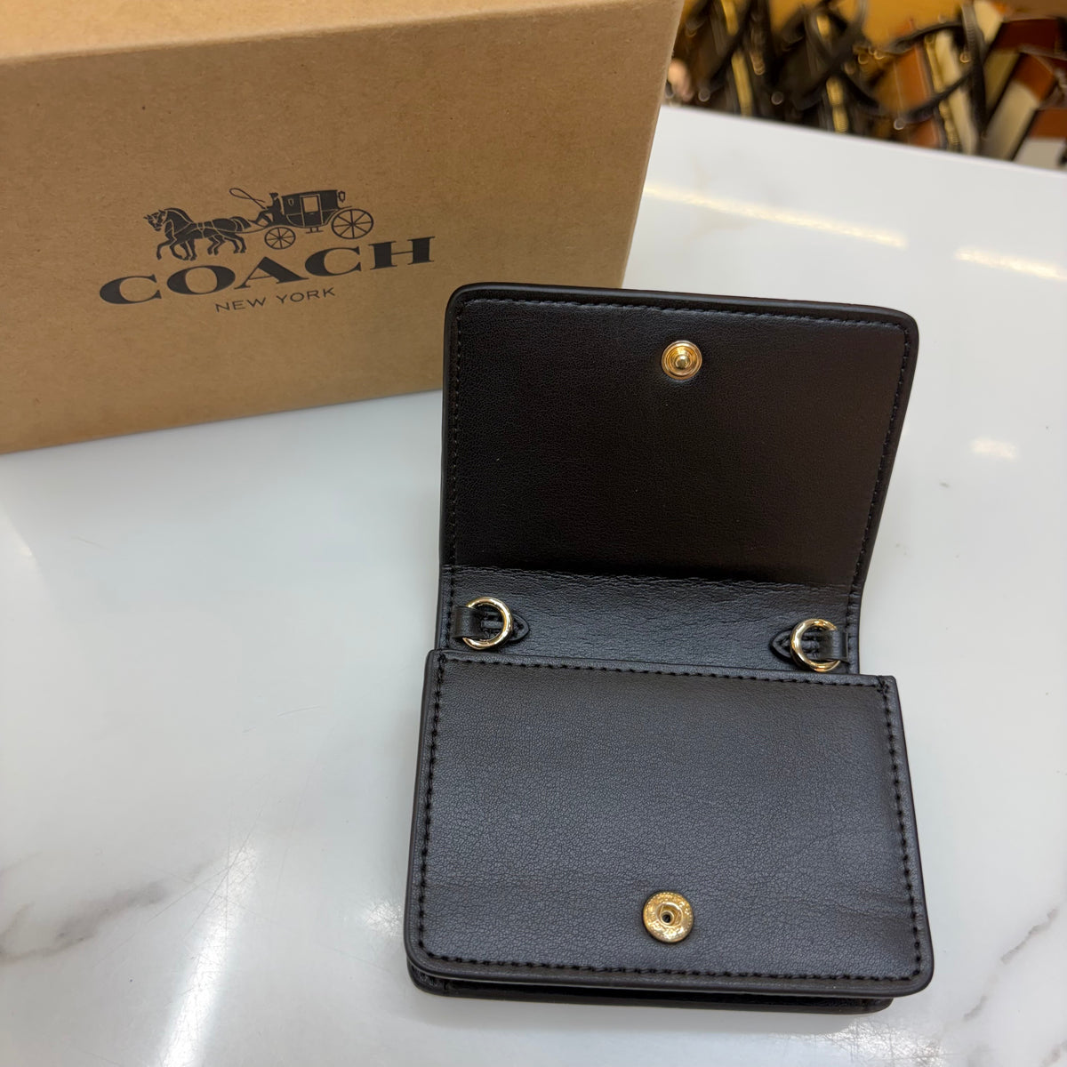 Coch Mini Wallet On A Chain In Signature Gold Walnut Black (Wristlet)