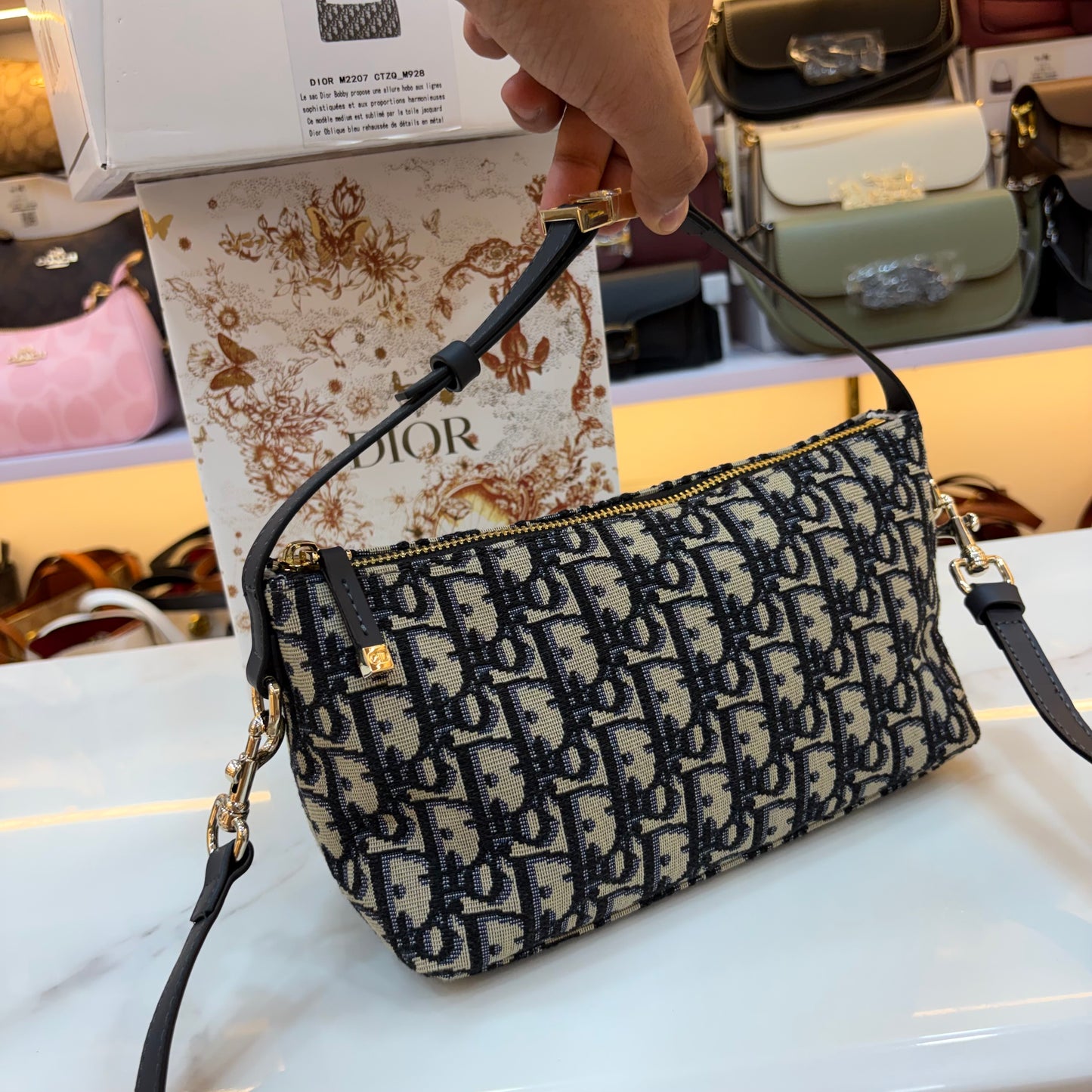 Medium CD Travel Nomad Pouch - Oblique jacquard and a military-inspired CD buckle