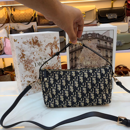 Medium CD Travel Nomad Pouch - Oblique jacquard and a military-inspired CD buckle